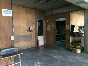 Entrance to the stockroom of the unfinished building where Lorenzo Peña was later found dead. (Photo by Erika Sauler, INQUIRER