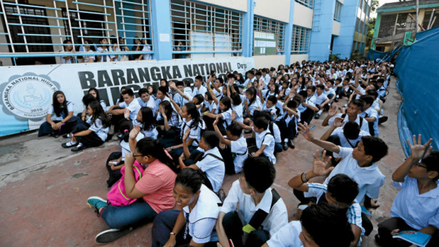 ORIENTATION Students of Barangka National High School in Marikina City attend an orientation meeting on the entry of Grade 11 students under the K-12 program. Classes open today in public elementary and high schools nationwide. NIÑO JESUSORBETA