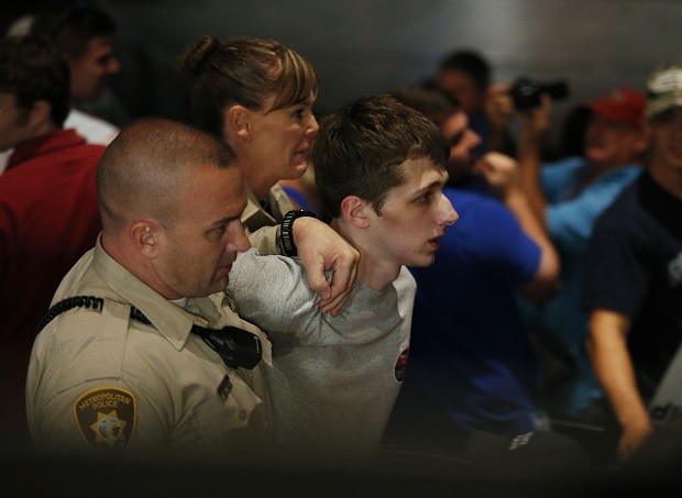 In this June 18, 2016, file photo, police remove protestor Michael Steven Sandford as Republican presidential candidate Donald Trump speaks at the Treasure Island hotel and casino in Las Vegas. Sandford, a British man accused of trying to take a police officer's gun and kill Donald Trump during a weekend rally in Las Vegas, will not be released on bail. Federal Magistrate Judge George Foley said at a hearing Monday that Sandford was a potential danger to the community and a flight risk. AP FILE PHOTO