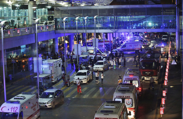 Security and rescue personnel gather outside Istanbul's Ataturk airport, early Wednesday, June 28, 2016. Two explosions have rocked Istanbul's Ataturk airport Tuesday, killing several people and wounding scores of others, Turkey's justice minister and another official said. A Turkish official says two attackers have blown themselves up at the airport after police fired at them. The official said the attackers detonated the explosives at the entrance of the international terminal before entering the x-ray security check. Turkish authorities have banned distribution of images relating to the Ataturk airport attack within Turkey. AP