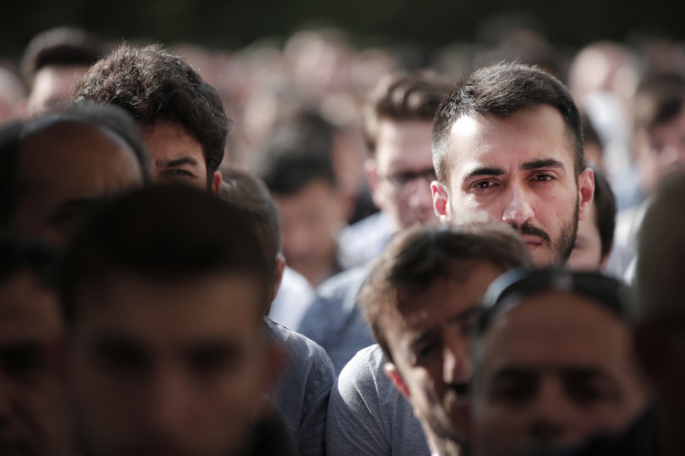 Mourners gather for the funeral of Muhammed Eymen Demirci, killed Tuesday at the blasts in Istanbul's Ataturk airport, in Istanbul's Basaksehir neighborhood, Wednesday, June 29, 2016. Demirci was 25 years old and worked for ground services at the airport. Suicide attackers killed dozens and wounded scores of others at the busy airport late Tuesday, the latest in a series of bombings to strike Turkey in recent months. Turkish authorities have banned distribution of images relating to the Ataturk airport attack within Turkey. (AP Photo/Lefteris Pitarakis) TURKEY OUT