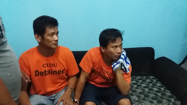 Wilfredo Lorenzo (right) and Rey Diaz are presented by the Quezon City Police District to the media on Thursday, June 23, 2016, after a sixth victim tagged them in a series of rapes and robberies targeting female commuters. (Photo by Erika Sauler, INQUIRER)