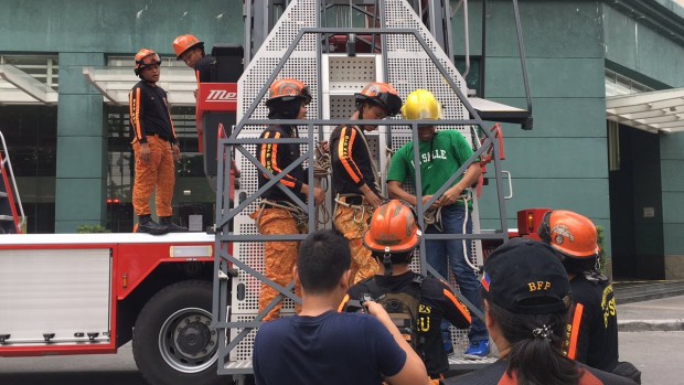 Members of the Bureau of Fire and Protection in Makati City use a high ladder to simulate a rescue operation in case the "Big One" strikes. YUJI VINCENT GONZALES/INQUIRER.net