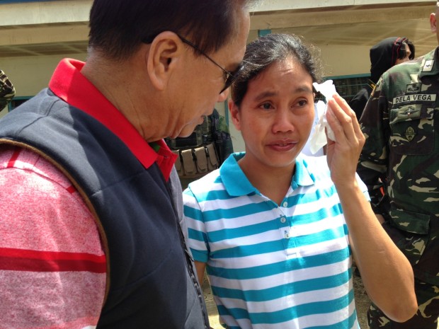 MARITESS FLOR / JUNE 24, 2016 Marites Flor in stripes is picked up by Secretary Jesus Dureza at the Jolo Airport and immediately brought to Davao City to present to incoming President Rodrigo Duterte. POOL PHOTO