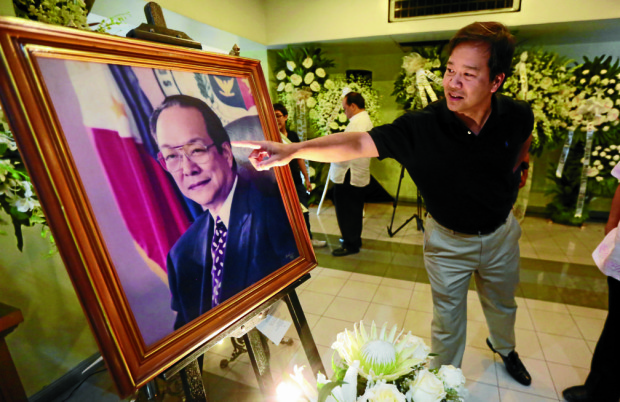  Emmanuel Maceda, eldest son of the late Sen. Ernesto Maceda, points to the glasses in the portrait of his father during the wake of Sen. Maceda at Mt. Carmel Church in Quezon City on Tuesday, June 21, 2016. INQUIRER PHOTO / GRIG C. MONTEGRANDE