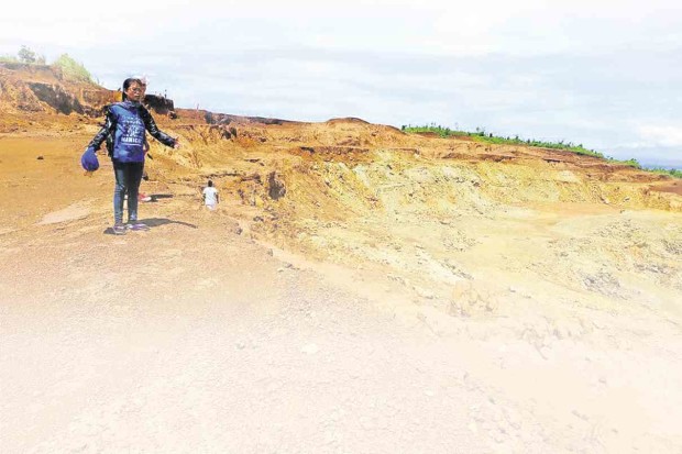 MINING has left this scar, an open pit stripped of all vegetation, on Manicani Island off the town of Guiuan in Eastern Samar province. PHOTO FROM PHILIPPINE MISEREOR
