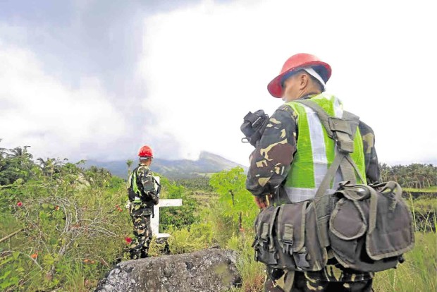 SOLDIERS patrol the village of Anoling in Camalig town, Albay province, one of the communities inside the 6-km radius permanent danger zone of Mayon Volcano.  MARK ALVIC ESPLANA /INQUIRER SOUTHERN LUZON