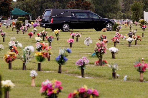 A Hearse that carried the body of Kimberly Morris drives through the cemetery after the burial for Morris, June 16, 2016 in Kissimmee, Florida. Morris, who worked as a bouncer at the Pulse Nightclub, was killed in the shooting. The shooting at Pulse Nightclub, which killed 49 people and injured 53, is the worst mass-shooting event in American history.  GETTY IMAGES/AFP PHOTO