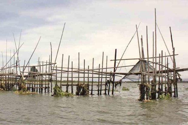 FISHING VILLAGE “Biyakos,” illegally built fishing structures, are installed in the middle of the Bicol River in the poor remote village of Punta Tarawal in Calabanga, Camarines Sur province. JUAN ESCANDOR JR.