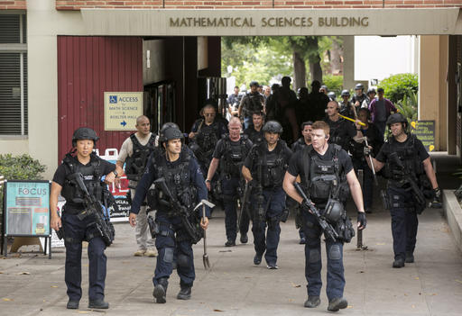Los Angeles Police officers walk by the Mathematical Sciences Building on the UCLA campus after a fatal shooting at the University of California, Los Angeles, Wednesday, June 1, 2016, in Los Angeles. Los Angeles police chief says shooting at UCLA was murder-suicide. AP Photo