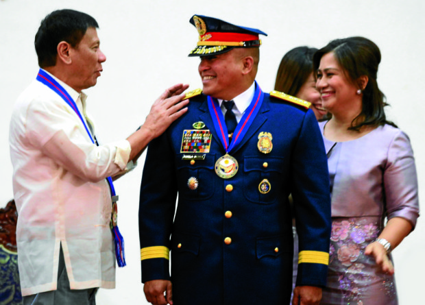 President Rodrigo R. Duterte leads Friday the Philippine National Police' assumption of command in Camp Crame, Quezon City. The President promotes the new PNP chief Dir. Gen. Ronald dela Rosa to become a four-star general.(KIWI BULACLAC/PPD)