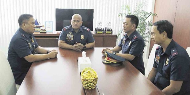 GENERAL PROBLEM Chief Superintendents Joel Pagdilao, Bernardo Diaz and Edgardo Tinio—three of the five active and retired police officials whom President Duterte named as protectors of drug lords—report to Philippine National Police Director General Ronald dela Rosa to manifest their cooperation in a formal investigation.  PHOTO COURTESY OF PNP-PIO