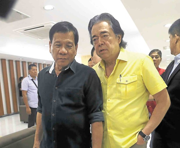  NEW AIDE Rocker and radio host Ramon   “RJ” Jacinto, shown in this 2015 photo with Davao City Mayor Rodrigo Duterte, is now the President’s adviser for economic affairs. INQUIRER FILE PHOTO 