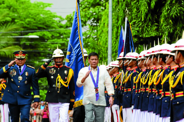 DUTERTE LEADS PNP TURNOVER CEREMONIES/ july 1,2016 President Rodrigo Roa Duterte troops the line during the PNP turnover ceremonies held in Camp Aguinaldo , Jul;y 1,2016.  The new  PNP Chief  Ronald "Bato" DELa Rosa joins the   President Duterte iin trooping the line. INQUIRER PHOTO/JOAN BONDOC