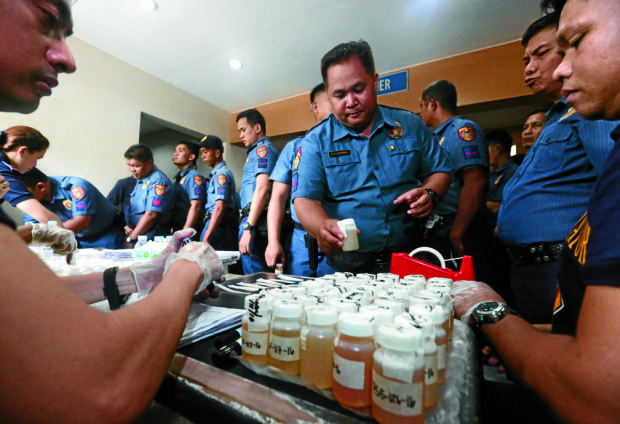 July 11, 2016 DRUG TEST- Station 9 police officers take a surprise drug test at the Quirino Grandstand on monday in an effort to clean up not just civilians but also the police force of illegal drug activities. INQUIRER/ MARIANNE BERMUDEZ