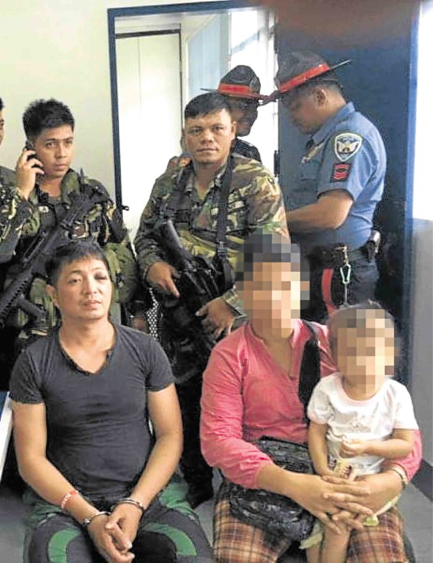 IN POLICE CUSTODY  Road rage suspect Vhon Tanto sits handcuffed inside the police station in Masbate province.  PHOTO FROM PHILIPPINE ARMY