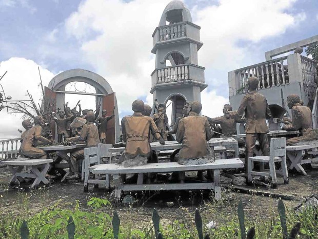 A LIFE-size diorama depicting the surprise attack by Filipino revolutionaries on a contingent of American colonial forces in Balangiga has been installed  in the plaza across the Balangiga Church and the municipal hall. CONTRIBUTED PHOTO