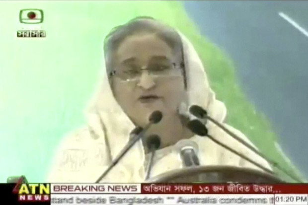 In this image made from video provided by ATN News, Bangladesh's Prime Minister Sheikh Hasina makes a nationally televised speech regarding the militant hostage-taking at a restaurant popular with foreigners in Dhaka, Bangladesh, Saturday, July 2, 2016. Hasina condemned the attack, which was claimed by the Islamic State group, and she said security officials arrested one of the militants. Bangladeshi forces stormed the Holey Artisan Bakery in Dhaka's Gulshan area where heavily armed militants held dozens of people hostage Saturday morning, rescuing some captives including foreigners at the end of the 10-hour standoff. (ATN News via AP Video)