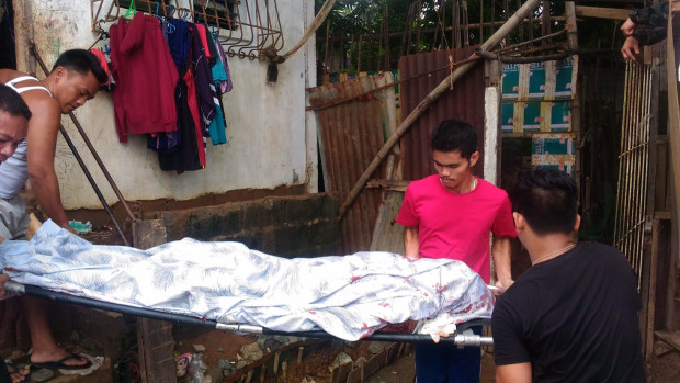 The body of drug suspect Jack Bertulfo is being taken out of his house after the Olongapo City police shot him dead when he tried to engage cops searching his house in a gunfight on Wednesday (July 13, 2016) afternoon. (Photo from the Olongapo City Police Office)