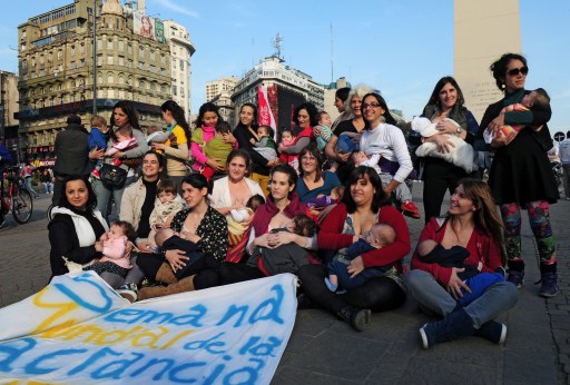 A group of women breastfeed their children at Republic square in Buenos Aires on August 4, 2013, during a self-organized demo to promote breastfeeding and break down the prejudice of doing it in public. AFP PHOTO / STR / AFP PHOTO / STR