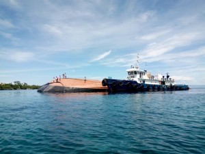 A capsized cargo barge, Castor II, off Barangay Bil-isan, Panglao, Bohol on July 4, 2016. (Photo by Leo Udtohan, Inquirer Visayas)