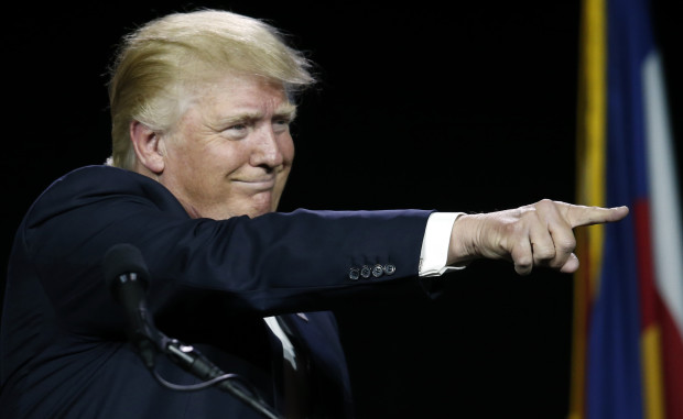 In this July 1, 2016, photo, Republican presidential candidate Donald Trump points to supporters during the opening session of the Western Conservative Summit in Denver.  Trump and the GOP are on track to defeat a move by insurgents to head off his nomination at this month’s Republican National Convention. Far from giving up, the dump Trump forces are continuing to seek new supporters and are spending money to run ads, hire staff and set up office space near the GOP convention site in Cleveland to try upending the party’s presumptive presidential nominee. (AP Photo/David Zalubowski)