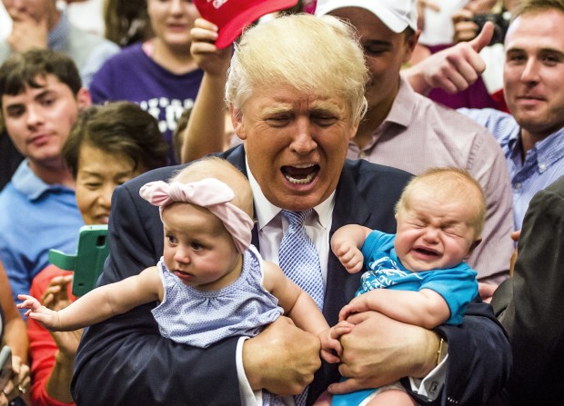 Republican presidential candidate Donald Trump holds baby cousins Evelyn Kate Keane, 6 months old, and Kellen Campbell, 3 months old, following his speech Friday, July 29, 2016, in Colorado Springs, Colo. (Stacie Scott/The Gazette via AP)