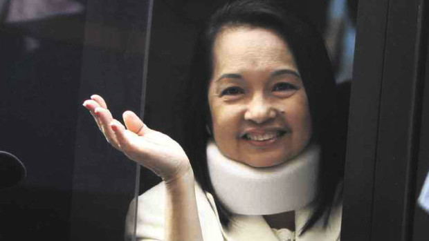 WAVING GOODBYE   Former President and now Pampanga Rep. Gloria Macapagal-Arroyo, shown in this 2012 file photo, might as well be waving goodbye to the plunder charges that the Supreme Court dismissed on Monday for “lack of evidence.”  INQUIRER FILE PHOTO