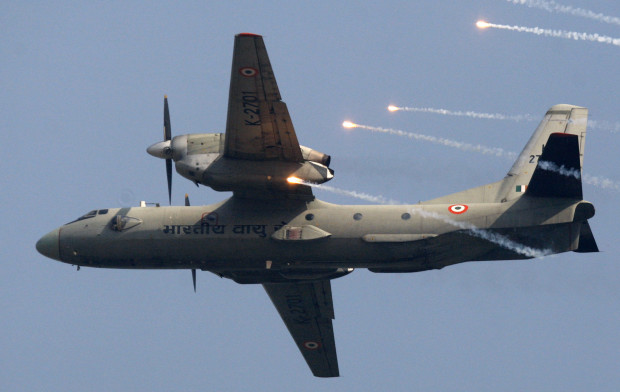 FILE- In this Thursday, Oct. 8, 2009, file photo, an Indian Air Force's (IAF) AN-32 transport aircraft releases chaff as it flies past the IAF Day Parade in New Delhi, India. A spokesman for India's defense ministry says the Indian air force has lost contact with a transport plane AN-32 with 29 people on board. A massive search by the air force, navy and coast guard has been launched. (AP Photo/Mustafa Quraishi, file)