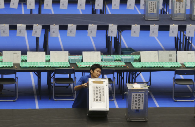 An election staff member carries a ballot box for voting at a ballot counting center in Tokyo, Sunday, July 10, 2016.  Japan's ruling coalition was a clear winner in Sunday's parliamentary election, Japanese media exit polls indicated, paving the way for Prime Minister Shinzo Abe to push ahead with his economic revival policies, but also possibly changing the nation's postwar pacifist constitution.(AP Photo/Koji Sasahara)