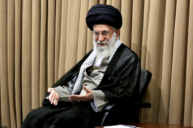 In this picture released by an official website of office of the Iranian supreme leader, Supreme Leader Ayatollah Ali Khamenei attends a meeting with Iranian officials in Tehran, Iran, on Tuesday, June 14, 2016. Iran's top leader says that if the next U.S. president tears up the nuclear deal, Iran will "light it on fire." Supreme Leader Ayatollah Ali Khamenei's remarks on Tuesday appeared to be aimed at presumptive Republican nominee Donald Trump, who has criticized the deal and vowed to renegotiate it. Khamenei referred to a "U.S. presidential candidate threatening to tear the deal up." The landmark nuclear agreement reached nearly a year ago granted Iran billions of dollars in sanctions relief in exchange for curbing its uranium enrichment program. (Office of the Iranian Supreme Leader via AP)