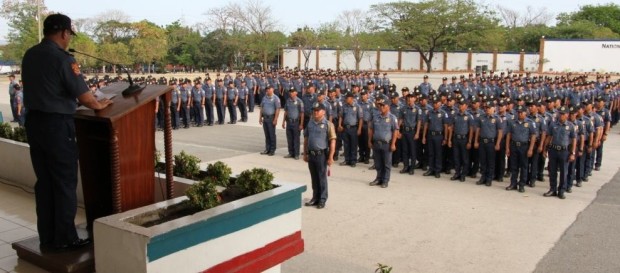Policemen under the National Capital Region Police Office (NCRPO) stand in attention during a public event.  (Photo taken from the NCRPO website, www.ncrpo.pnp.gov.ph)
