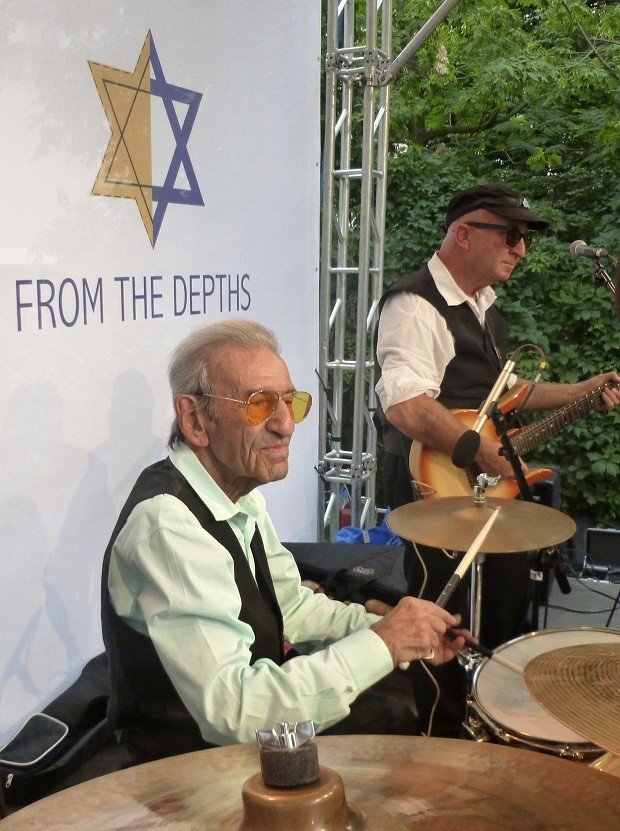 Saul Dreier, left, a 91-year-old Holocaust survivor from Poland who now lives in Florida, performs with his Holocaust Survivor Band at the site of the former Warsaw Ghetto in Warsaw, Poland, on Tuesday July 26, 2016. Two Holocaust survivors took to a stage at the site of the former Warsaw Ghetto this week to perform lively prewar tunes, with a 91-year-old on drums and an 88-year-old on accordion, keyboard and vocals.  Among the hundreds in the audience were several Polish Christians who saved Jews during the Holocaust, part of a complex relationship between Jews and Christians in Poland that Pope Francis will encounter during a somber visit to Auschwitz on Friday.  AP 
