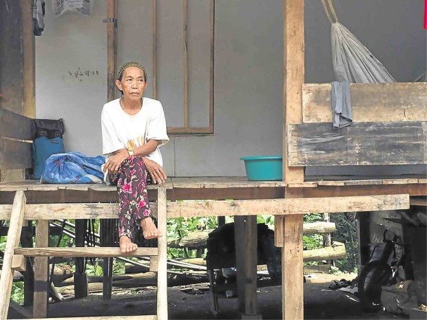 HADJIYA Asjail, a 60-year-old woman from the village of Magcawa in Al Barka town, Basilan, is one of hundreds of residents of three towns in the province who fled attacks by the Abu Sayyaf. Asjail sought shelter in this house behind a school in the town proper of Tipo-Tipo, awaiting government aid.