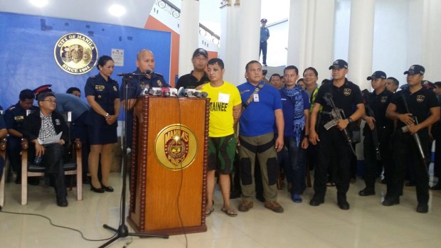 PNP chief Director General Ronald "Bato" Dela Rosa presents to the media Vhon Martin Tanto, the suspect in the Quiapo road rage shooting. KRISTINE FELISSE MANGUNAY/PHILIPPINE DAILY INQUIRER