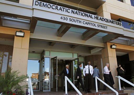 In this June 14, 2016 file photo, people stand outside the Democratic National Committee (DNC) headquarters in Washington. The computers of the House Democratic campaign committee have been hacked, an intrusion that investigators say resembles the recent cyber breach of the Democratic National Committee for which the Russian government is the leading suspect. AP FILE PHOTO