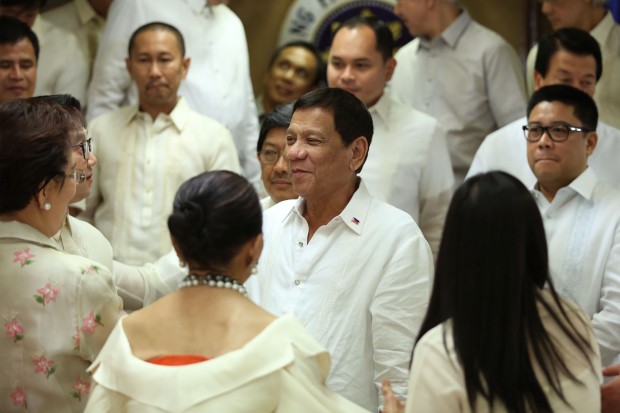 President Rodrigo R. Duterte is mobbed by members and officials of the League of Provinces of the Philippines (LPP) and League of Cities of the Philippines (LCP) after delivering his keynote speech at the Heroes' Hall of Malacañan Palace on July 27, 2016. KIWI BULACLAC/PPD