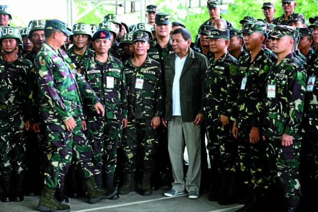  President Rodrigo Roa Duterte interacts with unit troops in formation during his visit in Brgy Palayan  Fort Magsaysay , Nueva Ecija. INQUIRER PHOTO/JOAN BONDOC