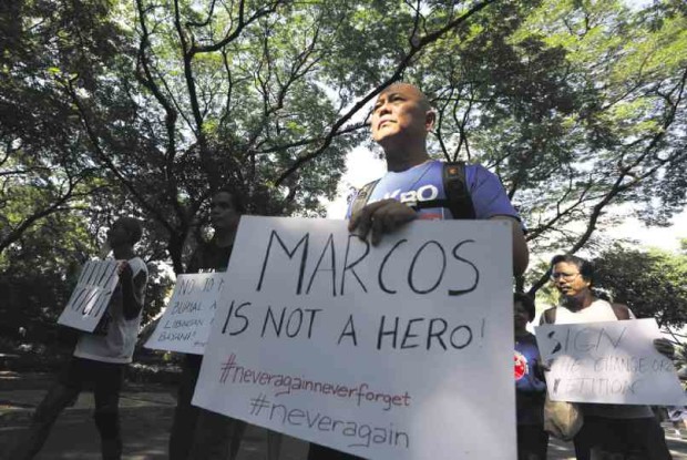 RUNNING PRIEST Father Robert Reyes makes his sentiments known on former President Ferdinand Marcos’ proposed burial at the Libingan ng mga Bayani.  NIÑO JESUS ORBETA