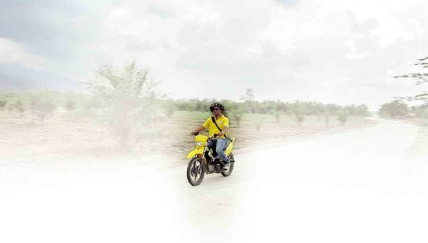 TENG Andal traverses this once muddy and pockmarked farm road in Barangay Bual in Isulan, Sultan Kudarat, with ease after it has been concreted under the Philippine Rural Development Project. GIAN ENRIQUEL/CONTRIBUTOR