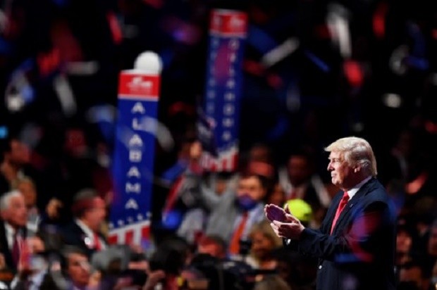 Republican presidential candidate Donald Trump acknowledges the crowd at the end of the Republican National Convention on July 21, 2016 at the Quicken Loans Arena in Cleveland, Ohio. Republican presidential candidate Donald Trump received the number of votes needed to secure the party's nomination. An estimated 50,000 people are expected in Cleveland, including hundreds of protesters and members of the media. The four-day Republican National Convention kicked off on July 18.  AFP