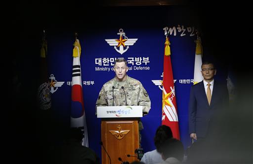 Lt. Gen. Thomas Vandal, the commander of U.S. Forces Korea's Eighth Army, center, speaks to the media about deploying the Terminal High-Altitude Area Defense, or THAAD as South Korean Defense Ministry's deputy minister for policy Yoo Jeh-seung, right, listens during a media briefing at the Defense Ministry in Seoul, South Korea, Friday, July 8, 2016. AP PHOTO