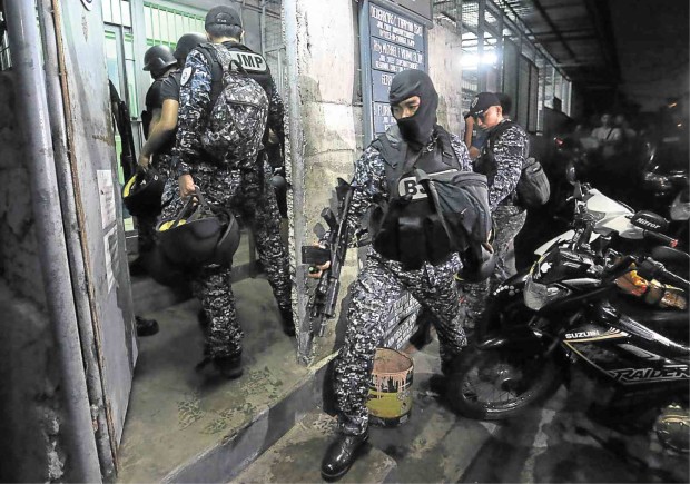 TIGHTENED SECURITY  A battle-ready unit from the Bureau of Jail Management and Penology takes over the Parañaque City jail following the deadly blast.              PHOTOS BY RAFFY LERMA
