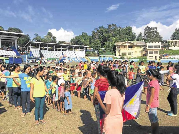  “LUMAD” children sing the national anthem before they attend classes at an evacuation center in Tandag City in Surigao del Sur province. NICO ALCONABA/INQUIRER MINDANAO