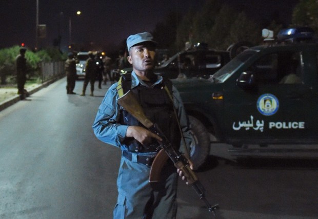 Afghan security personnel stand guard near the site of an explosion that targeted the elite American University of Afghanistan in Kabul on August 24, 2016. Explosions and gunfire rang out as militants stormed the elite American University of Afghanistan in Kabul on August 24, 2016, prompting desperate calls for help from students trapped inside classrooms, in the latest attack in the Afghan capital. No group has so far claimed responsibility for the assault, which comes just weeks after two university professors -- an American and an Australian -- were kidnapped at gunpoint near the school. / AFP PHOTO / WAKIL KOHSAR