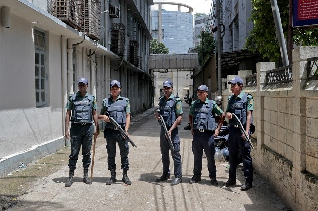 FILE - In this Wednesday, July 27, 2016, file photo, Bangladeshi policemen stand guard outside a morgue at the Dhaka Medical College Hospital during the autopsy on the bodies of suspected Islamic militants who were killed in Dhaka, Bangladesh. Police in Bangladesh, on Saturday, say they have killed three suspected militants, including one of two alleged masterminds of a major attack on a cafe last month that left 20 people dead. Top counterterrorism official Monirul Islam said police raided a two-story house in Narayanganj district near Dhaka and killed the suspects early Saturday. (AP Photo, File)