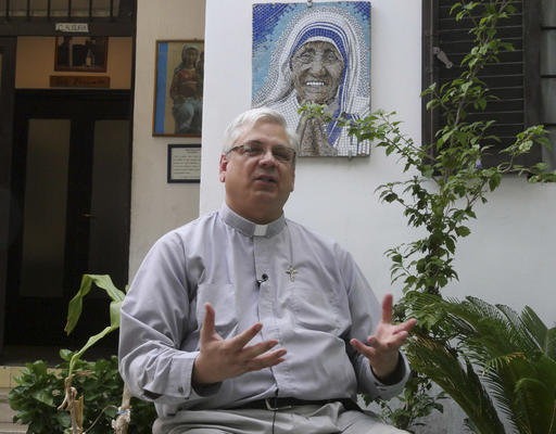 Rev. Brian Kolodiejchuk, postulator of the cause of beatification and canonization of Mother Teresa, is interviewed by the Associated Press in front of a mosaic picturing Mother Teresa, at the formation house of the priestly branch of the Missionaries of Charity on the outskirts of Rome, Friday, Aug. 18, 2016. AP