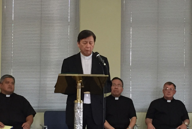 CORRECTS DATE TO WEDNESDAY, JULY 27, 2016  Archbishop Savio Hon Tai-Fai speaks in a news conference in Hagatna, Guam, Wednesday, July 27, 2016. Hon, the temporary administrator appointed to Guam by the Vatican in early June, is disavowing the church from statements made by his predecessor, who is facing sexual abuse allegations. (AP Photo/Grace Garces Bordallo)