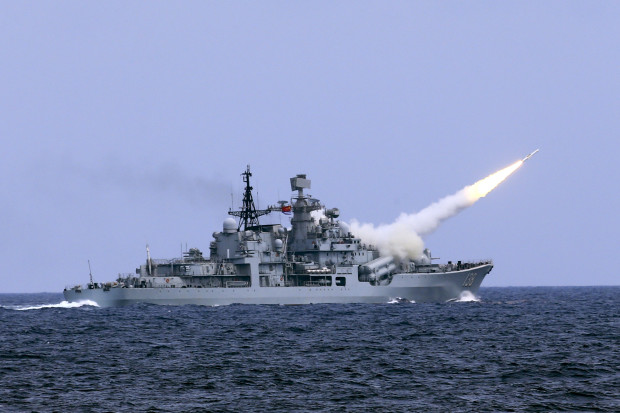 In this Aug. 1, 2016 photo released by Xinhua News Agency, a missile is launched from the guided-missile destroyer Taizhou during a live ammunition drill in the East China Sea. China's navy has fired dozens of missiles and torpedoes during exercises in the East China Sea that come amid heightened maritime tensions in the region. (Dai Zongfeng/Xinhua via AP)