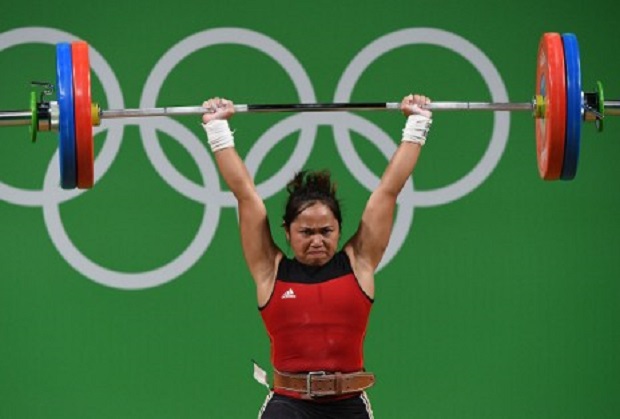 The Philippines' Hidilyn Diaz competes during the women's 53kg weightlifting event at the Rio 2016 Olympic games in Rio de Janeiro on August 7, 2016. Diaz won silver in the event, ending a 20-year medal drought for the Philippines in the Olympics. AFP